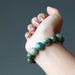 stretch beaded african turquoise  bracelet on female model hand