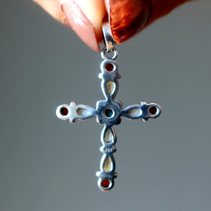 back of turquoise, pearl, coral cross pendant