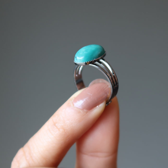 hand holding turquoise ring