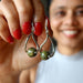 sheila of satin crystals holding unakite earrings