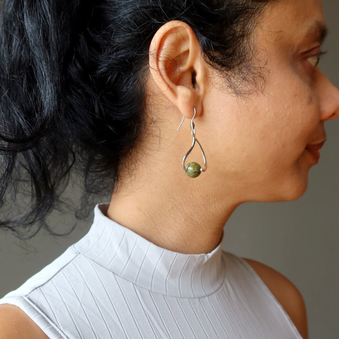 sheila of satin crystals wearing unakite earrings