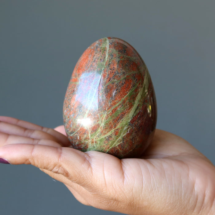 palm holding Pink Green Unakite Egg