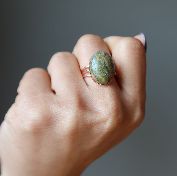 hand wearing unakite copper ring