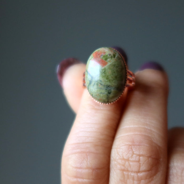 hand holding unakite copper ring