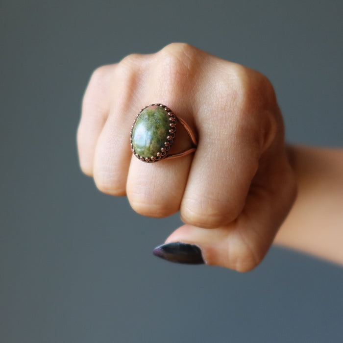 fist wearing unakite oval antique copper adjustable ring