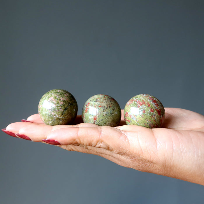 three unakite spheres
