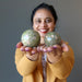sheila of satin crystals holding two unakite spheres