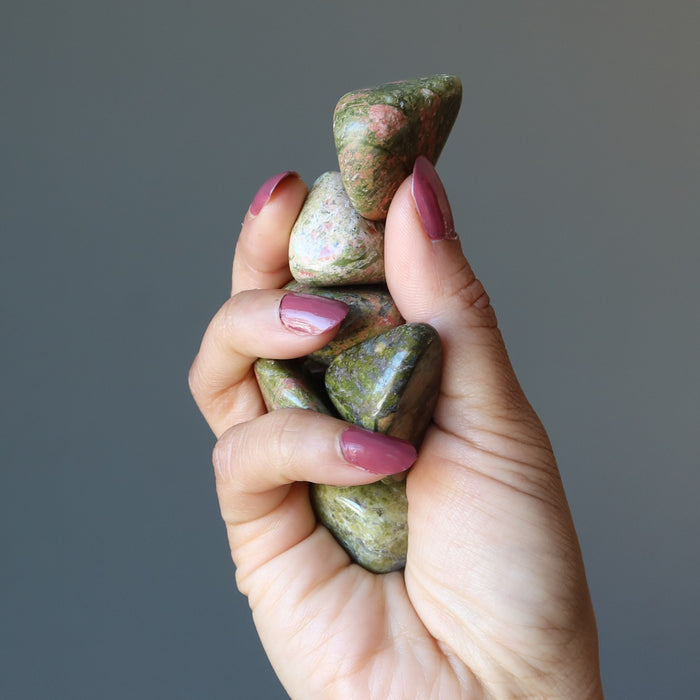 hand holding Unakite Tumbled Stones