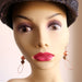 mannequin wearing Twist Copper Loops Unakite Earrings